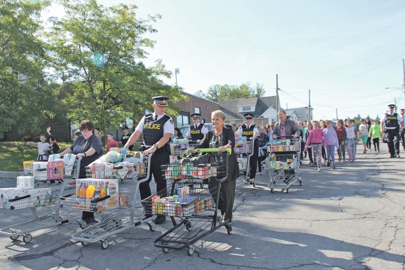 OPP officers collect food for citizens in need