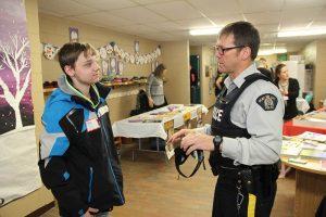 An OPP officer is seen speaking with a student at a "Reality Tour" event that was held in 2015, at Pleasant Corners Public School, in Vankleek Hill. The event teaches kids and their family members about the impact of drug and alcohol abuse. (Photo: Tara Kirkpatrick)