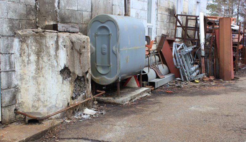 Some of the outside storage including an old oil tank right next to the Frappiers’ residence.