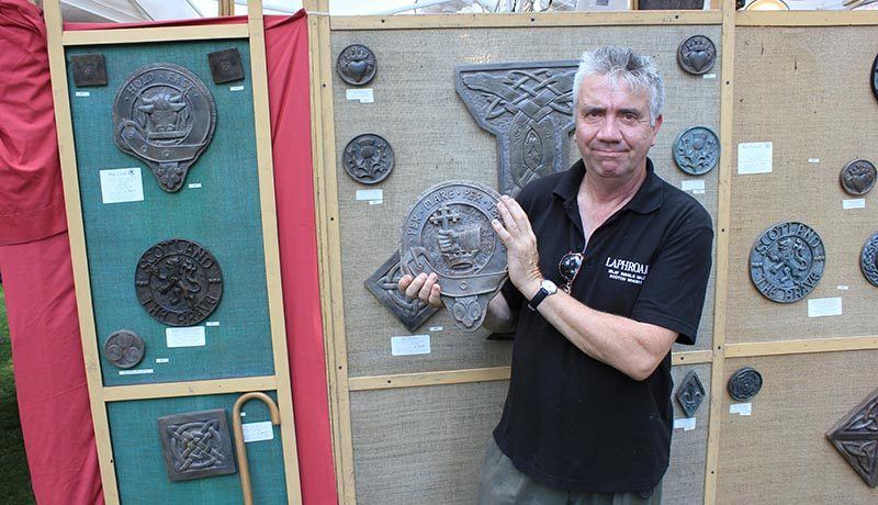 Duncan MacDonald, a stoneworker, creates Scottish family crests out of powdered stone. He lives in Scotland and makes the crests for museums and sells them to gift shop or to people at Scottish events. (Photo credit : Maxime Myre)