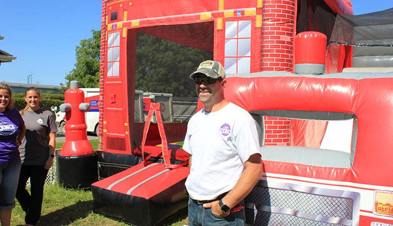 Eric St-Jean of Magic Bounce, a Hawkesbury-based inflatable game rental, offered a firefighter theme bouncy house for the kids.