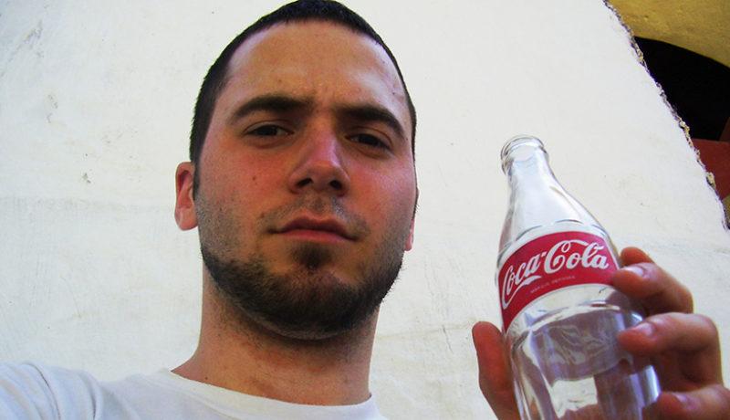 Yours truly, enjoying a coke next to a church. Apparently, back in 2008, the Abraham Lincoln beard was in style.
