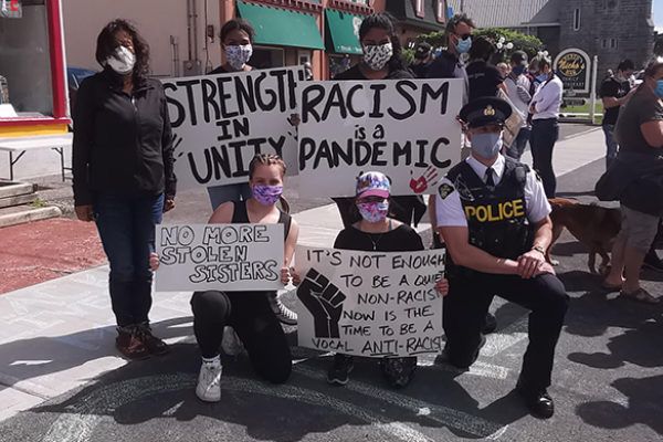 SUBMITTED JUNE 17 2020 PHOTO OF BLACK LIVES MATTER ORGANIZERS WITH POLICE OFFICER