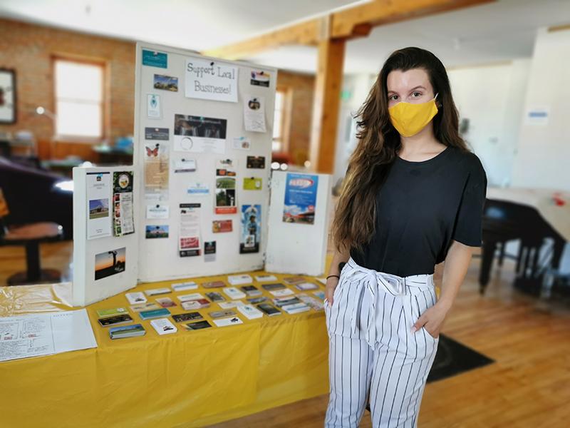 Summer student providing tourist info, boosting small businesses