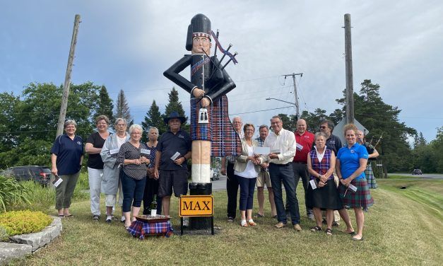 Max the piper welcomes visitors to Maxville